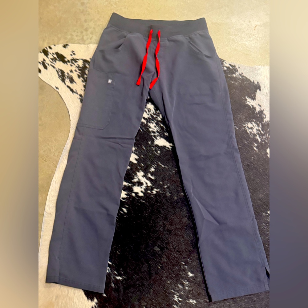 Women’s Fig Livingston scrub bottoms. Small tear with patch repaired as shown
